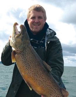 Willie Fetzer and a large brown trout on Bay de Noc, Lake Michigan.