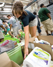 MSU student Emily Walsh sorts items donated for Fill the Bus, September 2011.