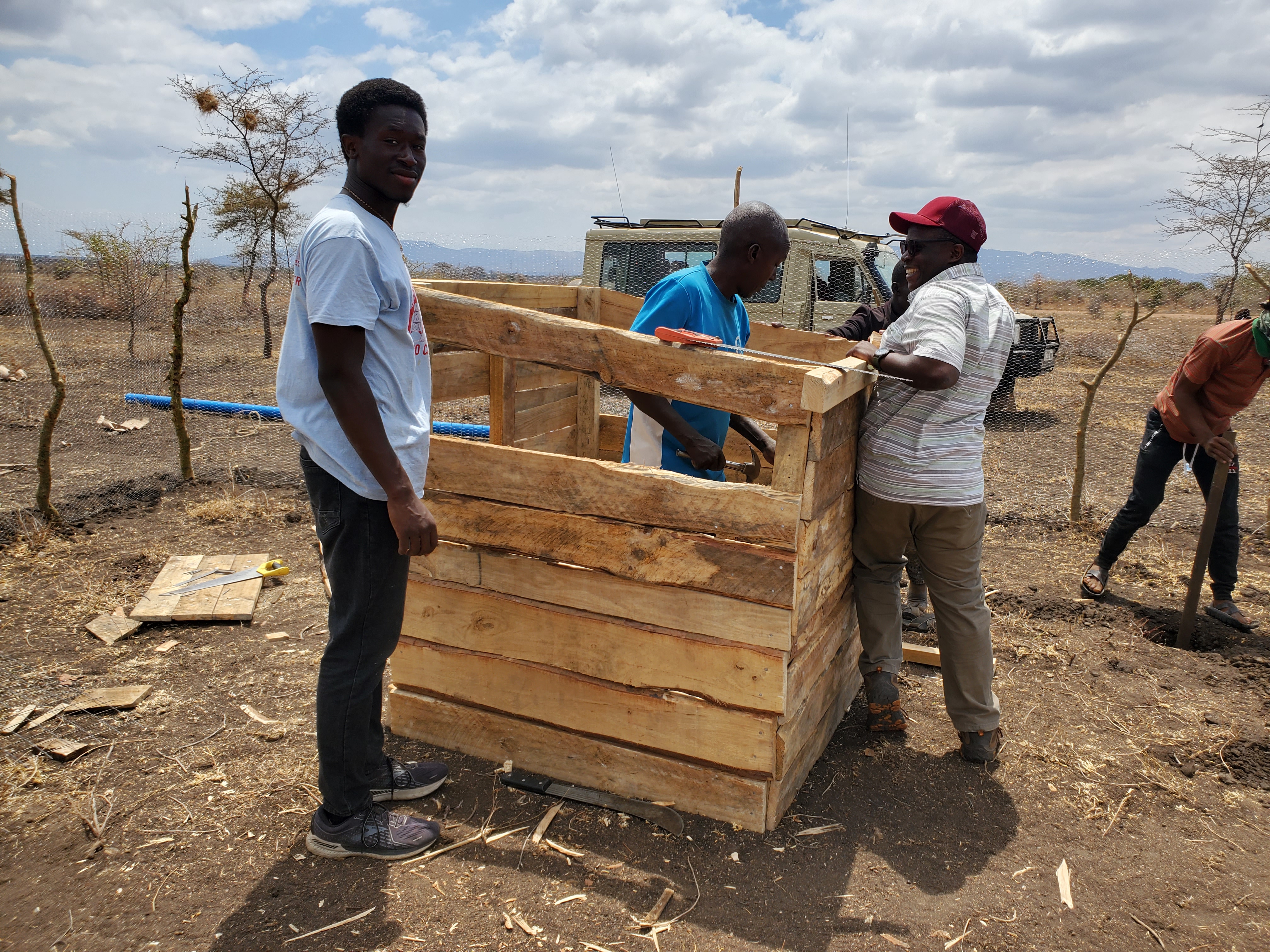 MSU students help build a chicken coop in Naitolia.