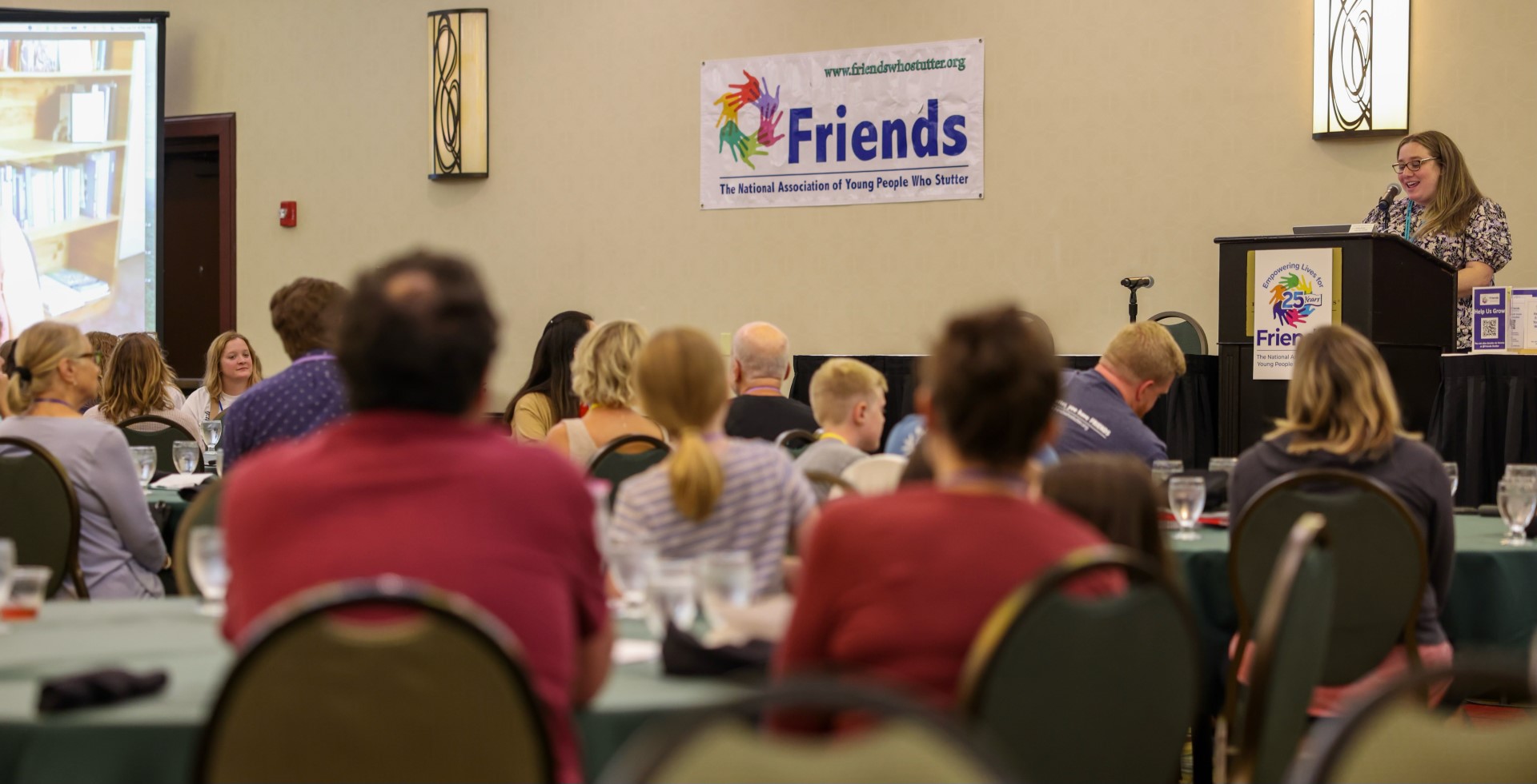 Caryn Herring speaks at a convention of Friends: The National Association of Young People Who Stutter.