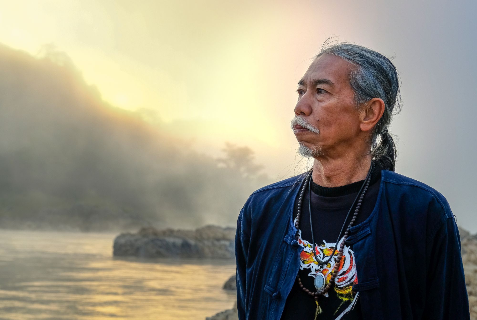 Niwat Roykaew (Khru Thi) looks out across the Mekong River.