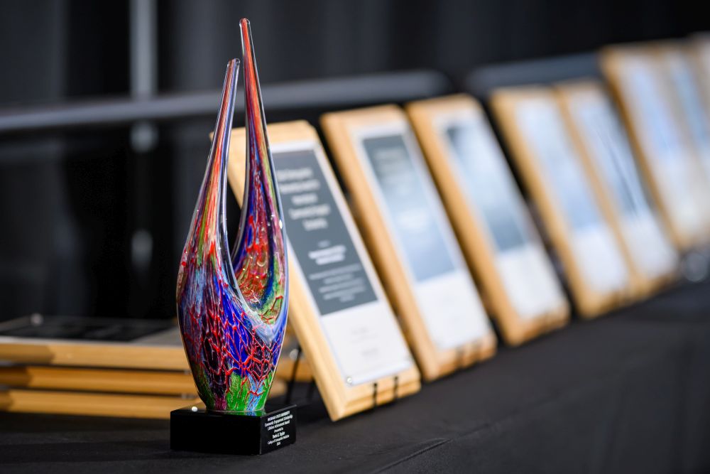 Michigan State University Community Engagement Scholarship Awards displayed on a table prior to the ceremony