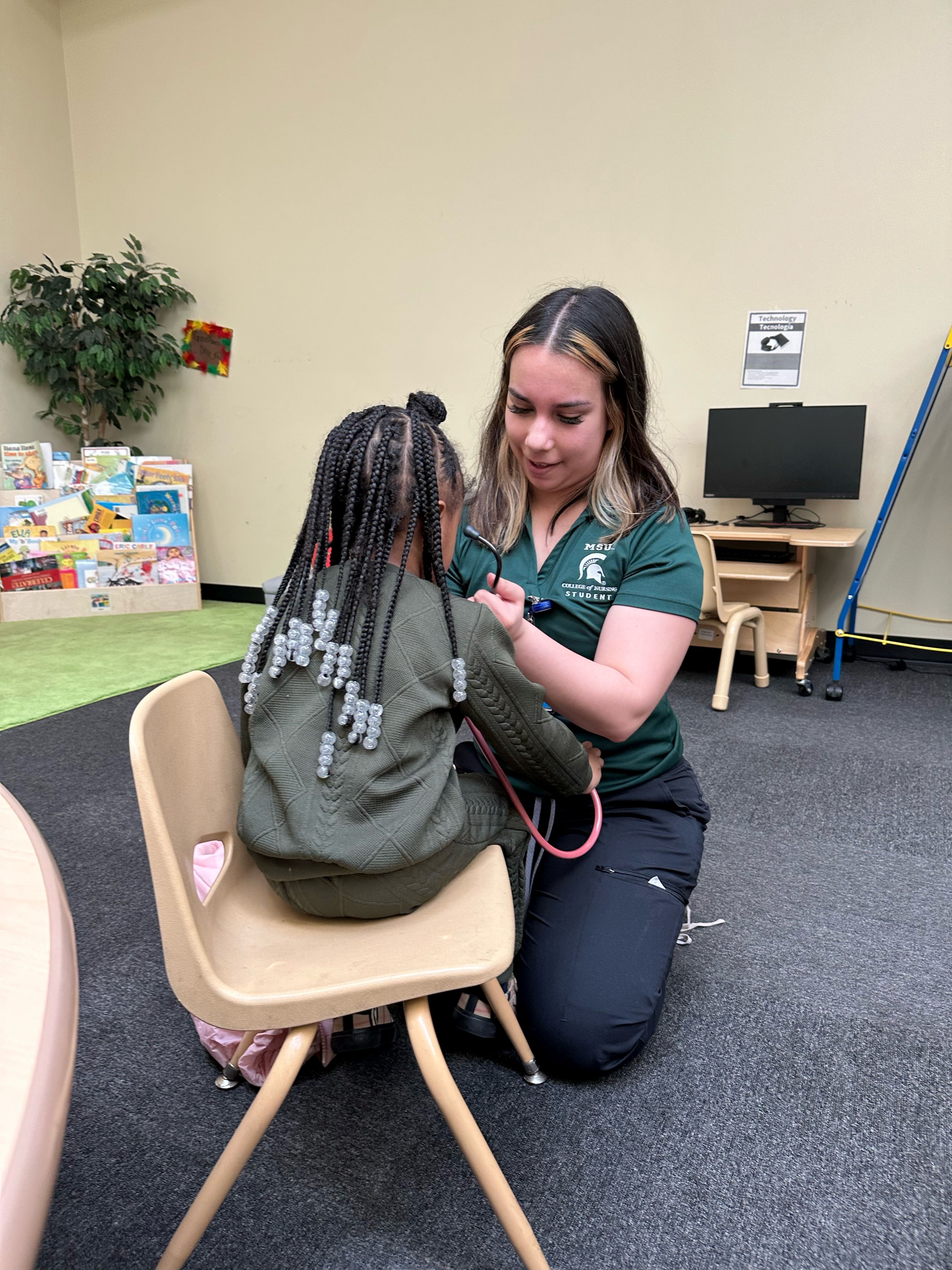 Lexie Salazar listens for changes in breath sounds.