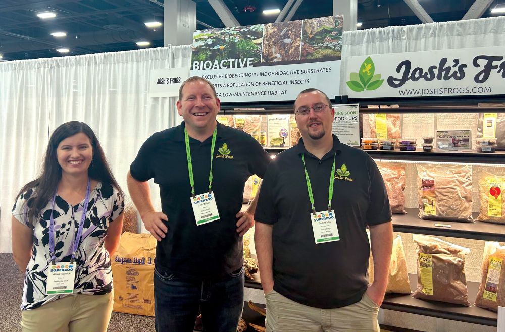 At SuperZoo, Alexa Warwick is pictured with Josh Willard and Zach Brinks of Josh's Frogs.