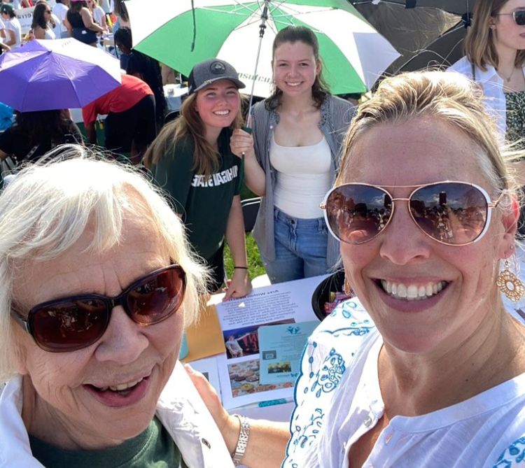 Marcia Van Ness, a member of the East Lansing Seniors Commission, and Melissa Fore braved an 89-degree day to promote Generations Connect at Sparticipation 2024. In the background are MSU students Emily Mason and Eleanor Pugh. Van Ness serves as a liaison to Generations Connect, promoting the program and offering a senior perspective.