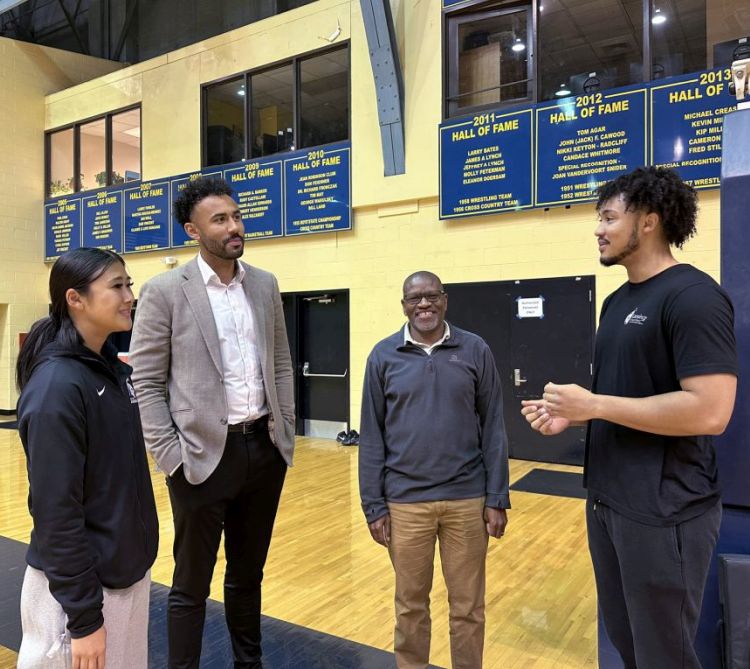 MSU student researchers work with Lansing Public School students alongside coaches and trainers. From left: Emily Hayashi, a first-year doctoral student, Jon Horford, Leps Malete, and trainer Josh Horford.