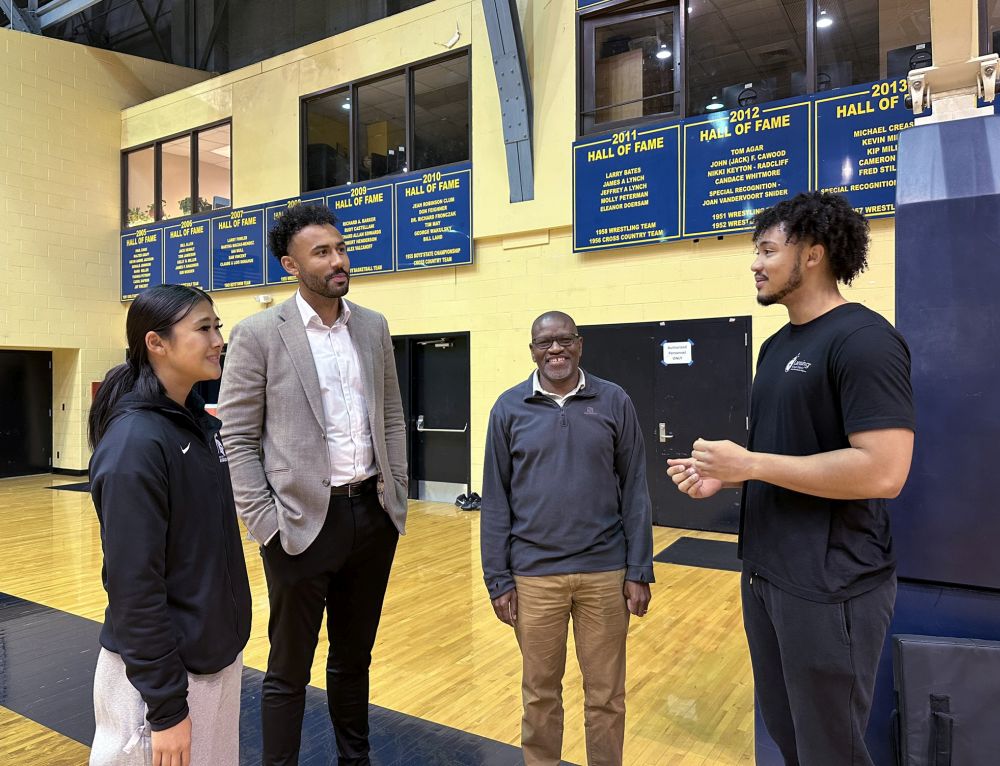 MSU student researchers work with Lansing Public School students alongside coaches and trainers. From left: Emily Hayashi, a first-year doctoral student, Jon Horford, Leps Malete, and trainer Josh Horford.