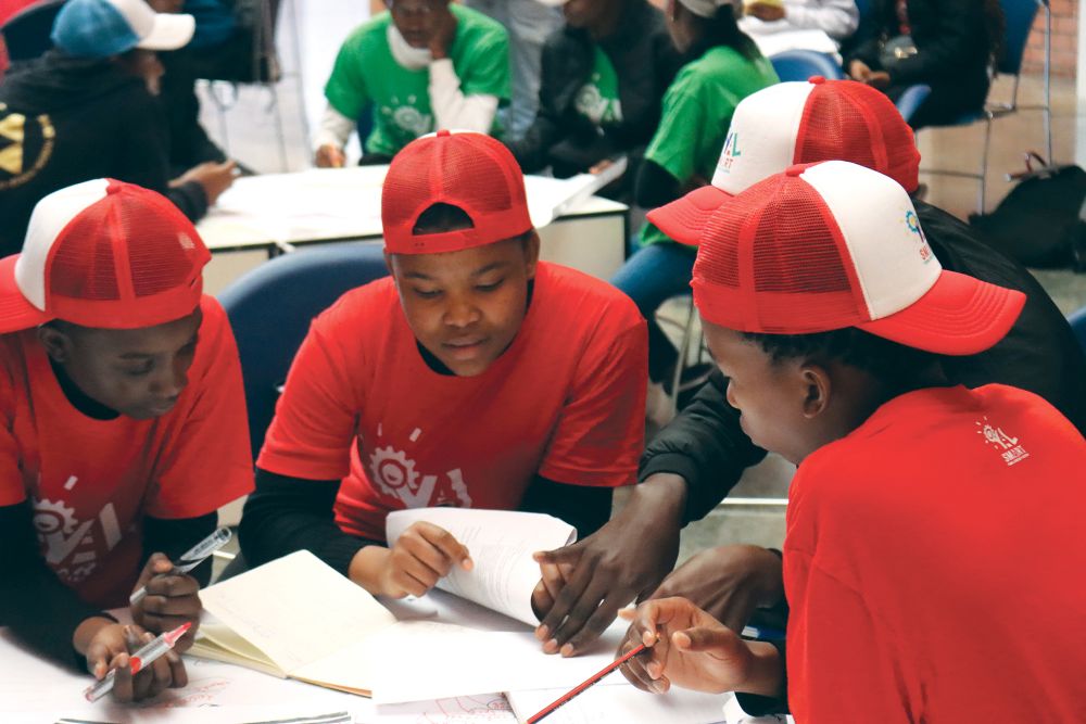 High school students in Botswana learn and brainstorm about ways to improve infrastructure and mobility innovations to promote physical activity and well-being as part of the Y’AL-SMART project designed to empower young African leaders.