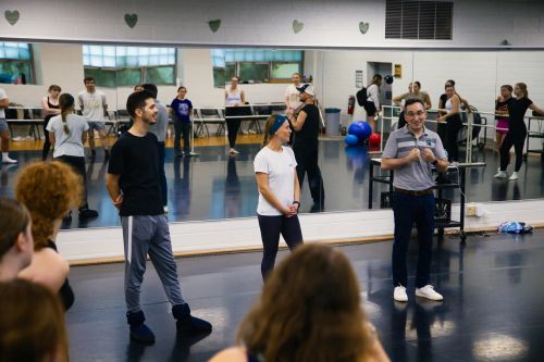 Instructors from Bullfrogs Ballet and an MSU theatre professor talk to students in a dance studio.