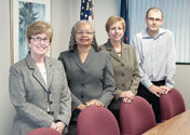 Roman (left) and Meghea (right) with MDCH partners Alethia Carr (second) and Susan Moran (third).