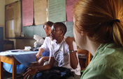 MSU-SWB members Justin Rowe, Tula Ngasala, and Lisa Warner discuss education program on sanitary practices at a primary school office in Mabibo, Dar es Salaam.