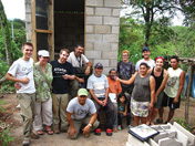 Ribbon-cutting committee of GAIA, MSU-EWB, and EWB Detroit Professional Chapter members with beneficiary family formally opens a latrine in El Balsamar, El Salvador.