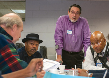 Bob Brown works with community members in Flint.