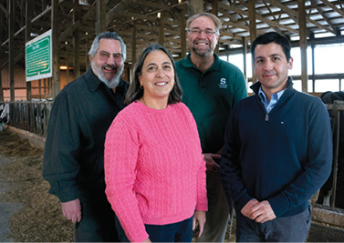 MSU Quality Milk Alliance members Rubén Martinez, Lorraine Sordillo, Ron Erskine, and Andrés Contreras at the MSU Dairy Farm.