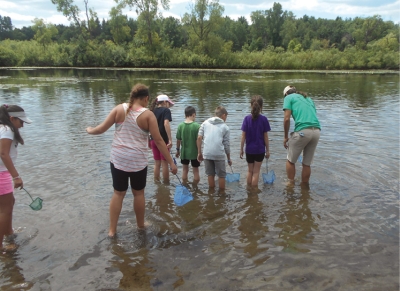 Youth at 4-H Great Lakes Natural Resources Camp learn about ecological concepts such as coastal ecology, fisheries management, limnology, invasive species management, and forestry.