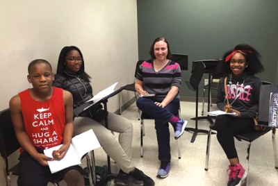 Juliet Hess, assistant professor in the College of Music, works with Verses students during lesson time.