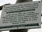 Site of angler interviews, Deer Lake, Marquette County. Sign warns of fish contamination.