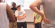 Rapper Invincible (in white T-shirt) leads a youth workshop at Urban Literacies Institute for Transformative Teaching (ULITT), June 2012.